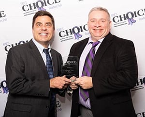 Photo of attorneys Michael S. Jan Janin accepting Erie's Choice award 2018